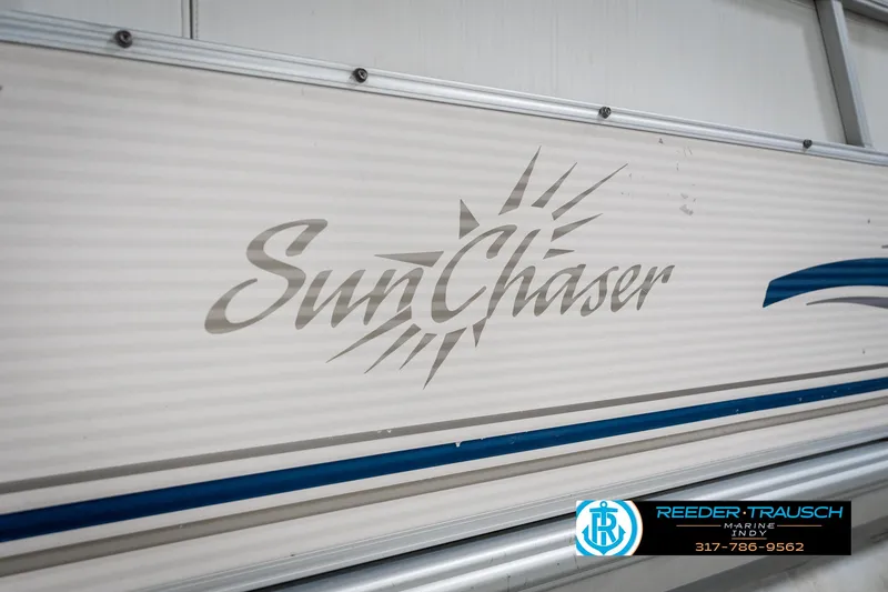 Slide: The Image of SunChaser 820 boat logo, 2005 model, displayed on a white and blue panel. - 41