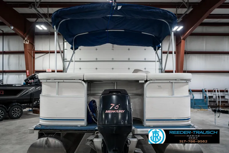 Slide: The Image of 2005 SunChaser 820 pontoon boat with Mercury engine in indoor storage. - 8