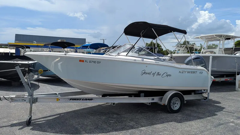 The Image of 2021 Key West 203 DFS boat on trailer, labeled "Jewel of the Cape," in a parking lot. - 0