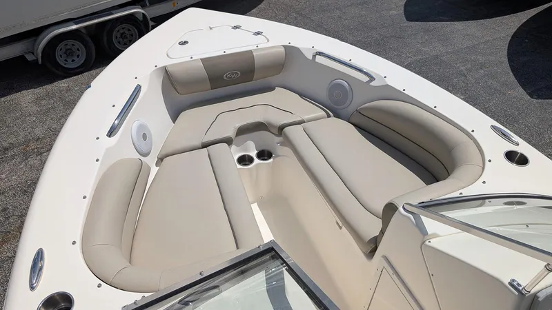 Slide: The Image of 2021 Key West 203 DFS boat interior with beige seating and cup holders. - 17