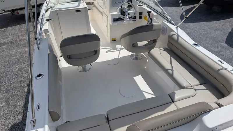 Slide: The Image of 2021 Key West 203 DFS boat interior with seating and steering console. - 5