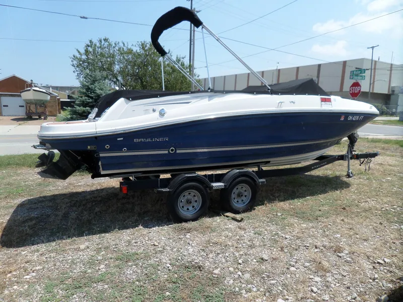 The Image of 2017 Bayliner VR6 Bowrider I/O on trailer, parked outdoors, side view. - 1