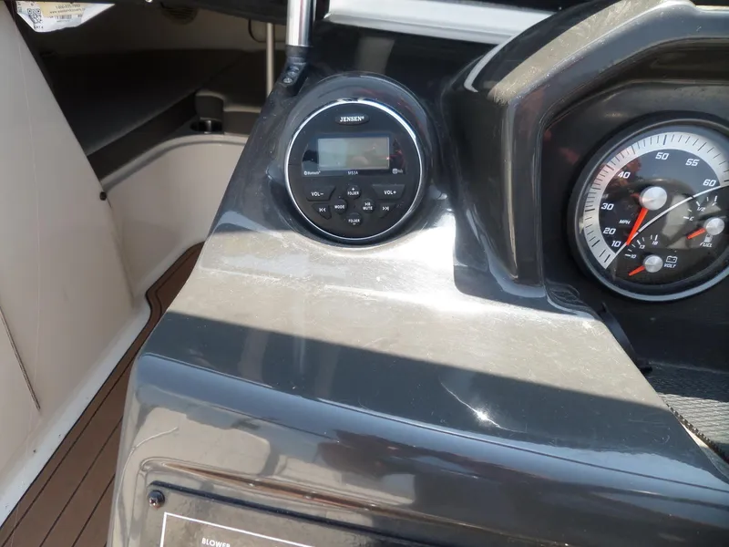 Slide: The Image of 2017 Bayliner VR6 Bowrider I/O dashboard with speedometer and Jensen audio system. - 16