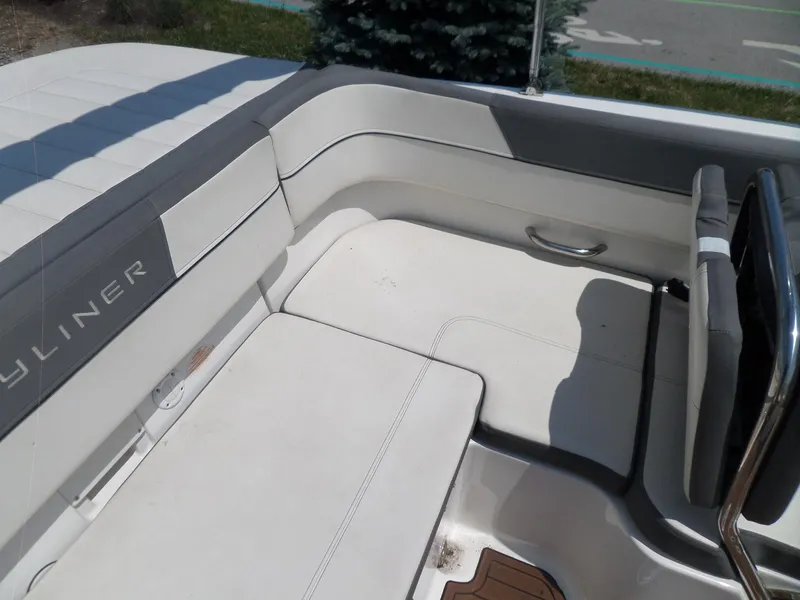 Slide: The Image of 2017 Bayliner VR6 Bowrider I/O interior seating with white and gray upholstery. - 24
