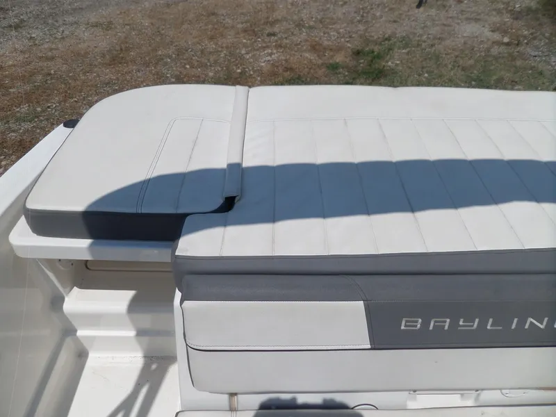 Slide: The Image of 2017 Bayliner VR6 Bowrider I/O boat seating area, featuring white and gray upholstery. - 25