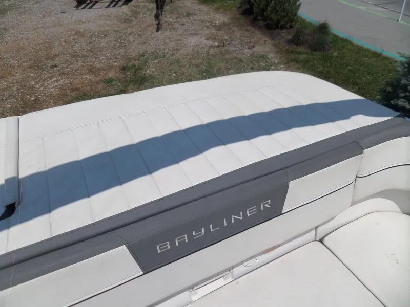 Slide: The Image of 2017 Bayliner VR6 Bowrider I/O boat with white seating and Bayliner logo. - 26
