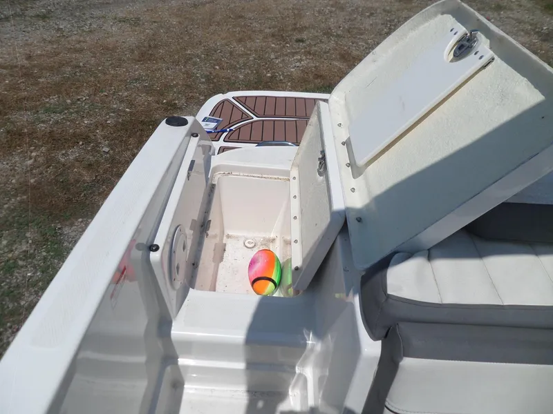 Slide: The Image of 2017 Bayliner VR6 Bowrider I/O with open storage compartment and colorful ball inside. - 29
