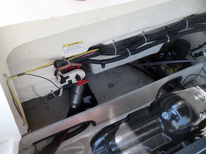 Slide: The Image of Engine compartment of 2017 Bayliner VR6 Bowrider I/O with wiring and components visible. - 30