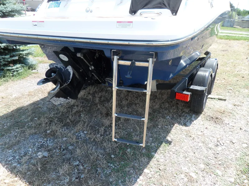 Slide: The Image of 2017 Bayliner VR6 Bowrider I/O on trailer, showing rear ladder and propeller. - 39