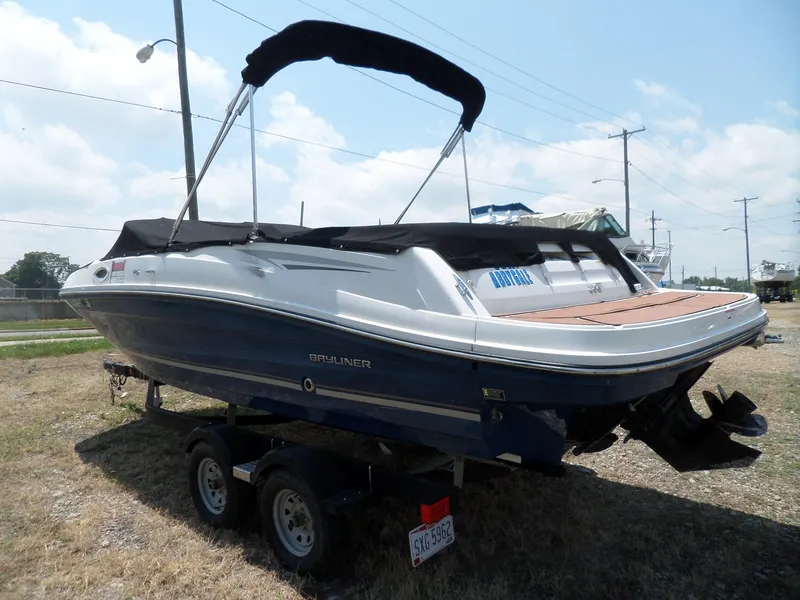 Slide: The Image of 2017 Bayliner VR6 Bowrider I/O on trailer, covered, parked outdoors. - 5