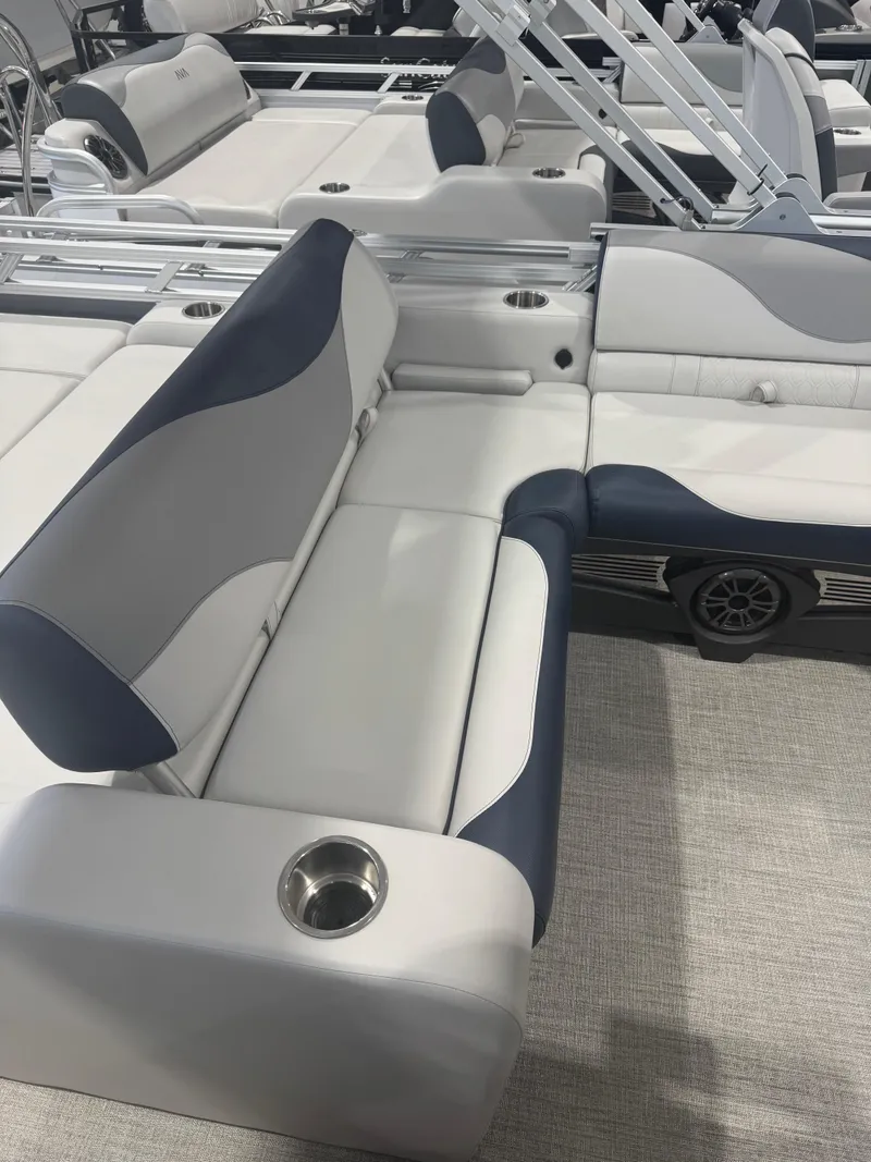 Slide: The Image of Luxurious seating on 2025 Avalon 2385 25 LSZ VRL pontoon boat with cup holders. - 10