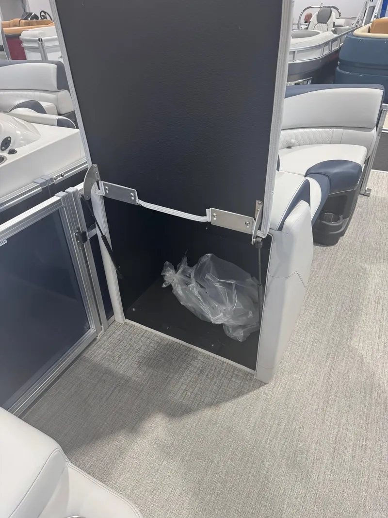 Slide: The Image of Open storage compartment in 2025 Avalon 2385 25 LSZ VRL boat interior. - 12