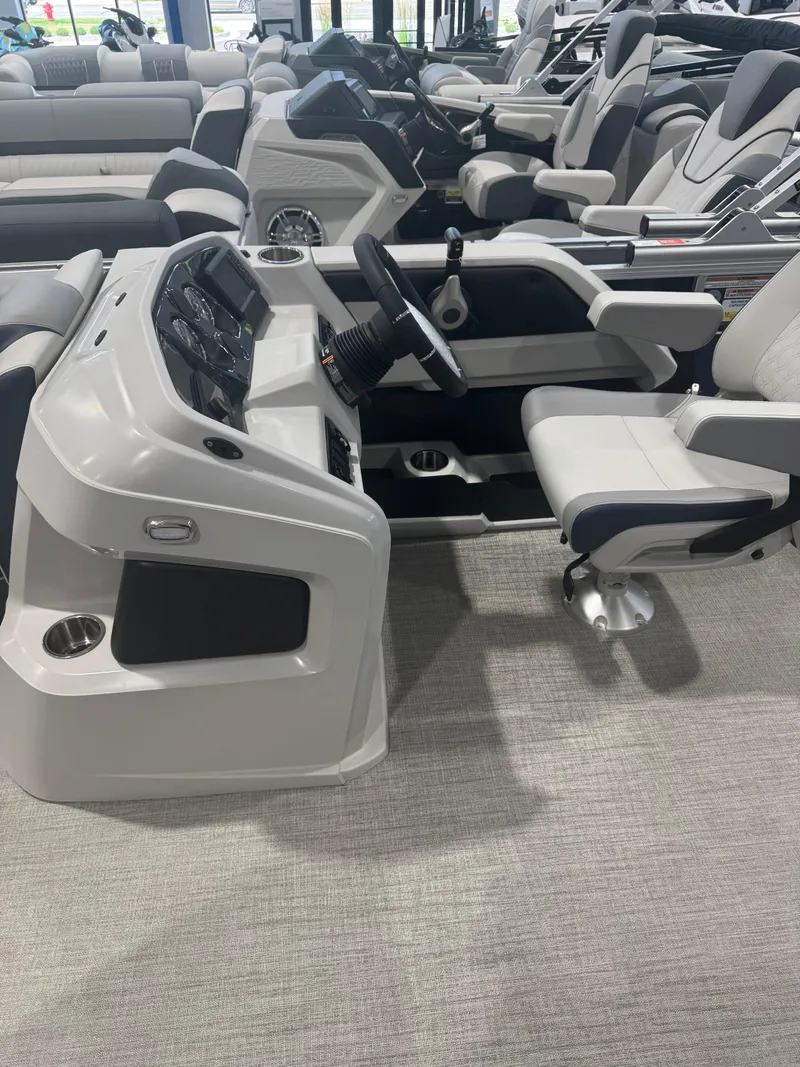 Slide: The Image of Interior of 2025 Avalon 2385 25 LSZ VRL pontoon boat with modern seating and controls. - 5