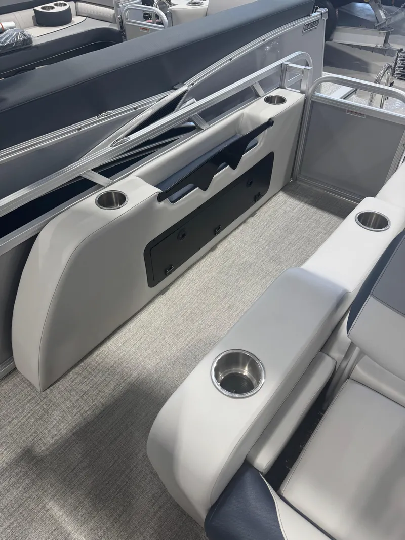 Slide: The Image of 2025 Avalon 2385 25 LSZ VRL boat interior with cup holders and seating. - 8