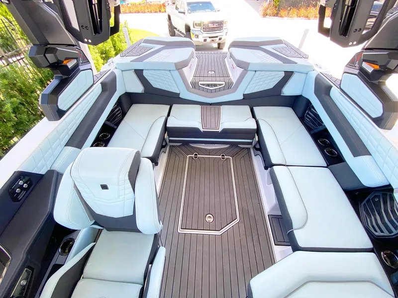 Slide: The Image of 2024 Nautique Super Air Nautique G21 interior with luxurious seating and modern design. - 7