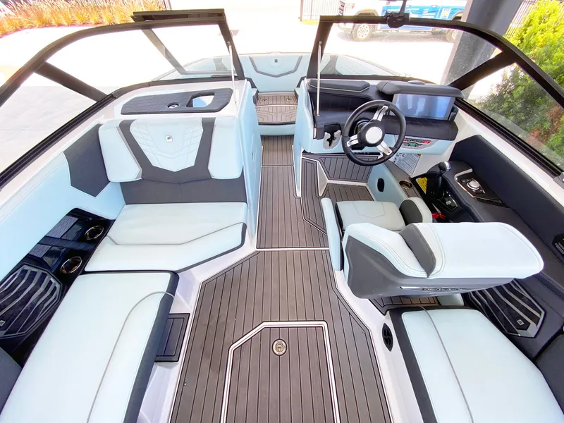 Slide: The Image of 2024 Nautique Super Air Nautique G21 interior with sleek seating and modern dashboard design. - 8