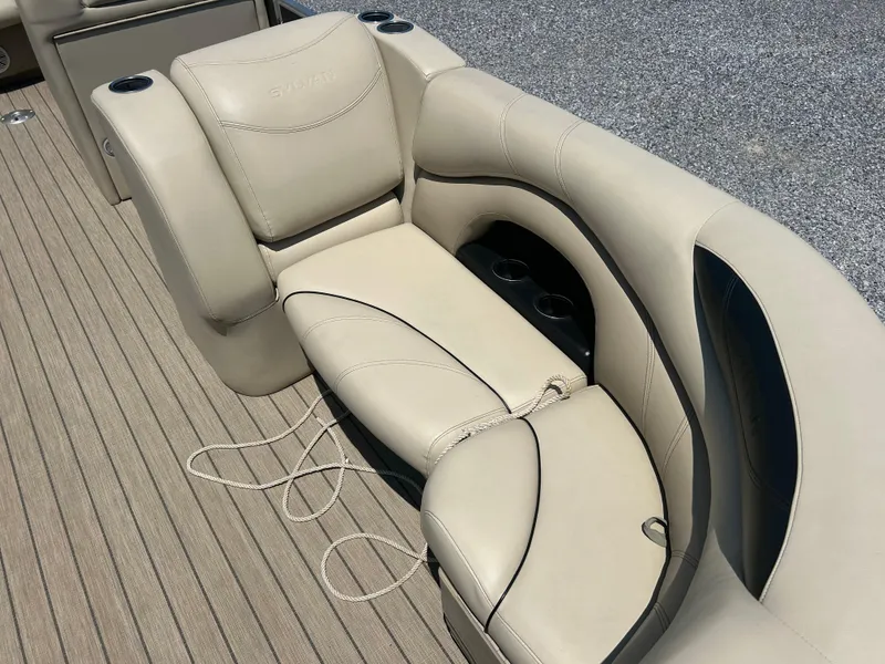 Slide: The Image of 2018 Sylvan Mirage 8522 Cruise boat seat with beige upholstery and cup holders. - 10