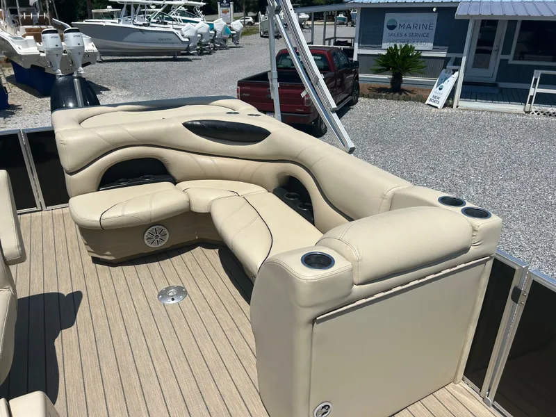 Slide: The Image of Luxurious seating on 2018 Sylvan Mirage 8522 Cruise pontoon boat, featuring beige upholstery. - 11