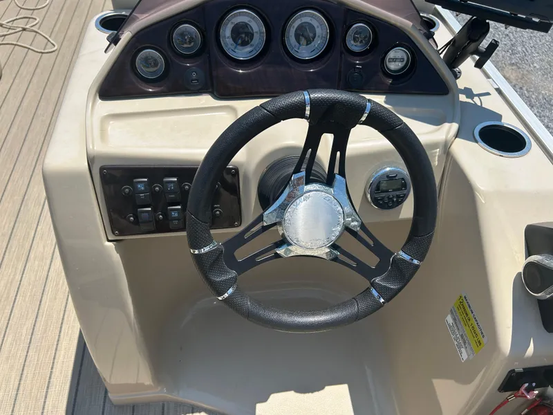 Slide: The Image of Steering console of 2018 Sylvan Mirage 8522 Cruise boat with gauges and controls. - 14