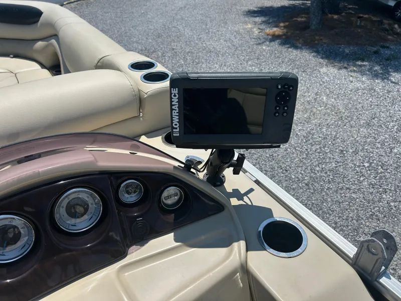 Slide: The Image of 2018 Sylvan Mirage 8522 Cruise dashboard with Lowrance fish finder and gauges. - 15