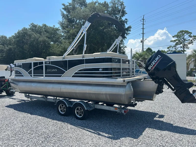 Slide: The Image of 2018 Sylvan Mirage 8522 Cruise pontoon boat with Suzuki outboard motor on trailer. - 5