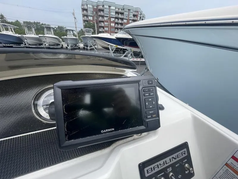 Slide: The Image of Garmin GPS on 2022 Bayliner 170 Element boat dashboard, with other boats in the background. - 6