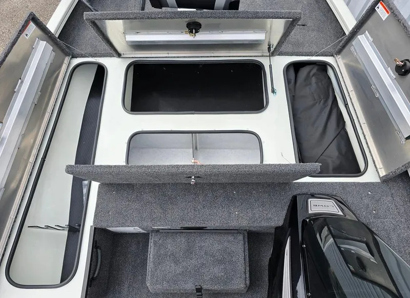 Slide: The Image of Bow storage compartments with open hatches, showcasing ample storage space & 23 gallon aerated livewell. - 5