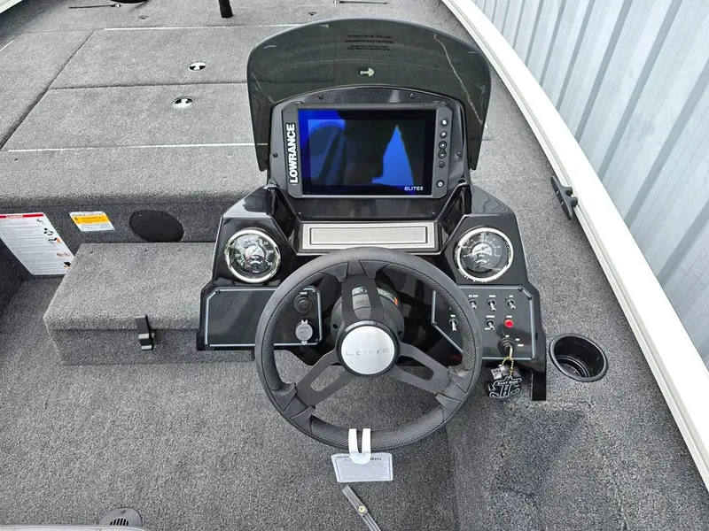 Slide: The Image of 2025 Lowe Stinger ST175 dashboard with multi function gauges and Lowrance Elite 9 display. - 9