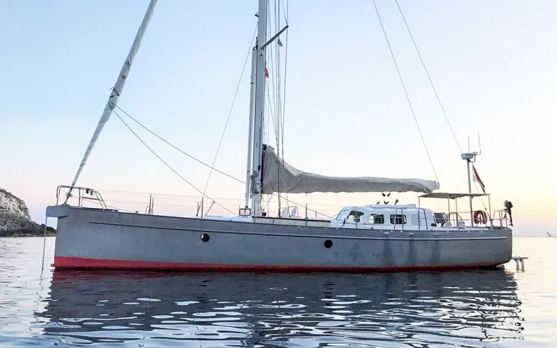 Slide: The Image of Sleek Bestevaer 53 S/Y sailboat, 2026 model, anchored on calm waters at sunset. - 6