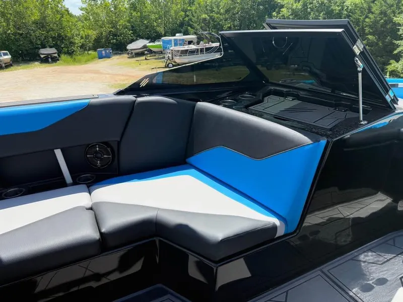 Slide: The Image of 2023 ATX Surf Boats 24 Type-S interior with blue and gray seating. - 11