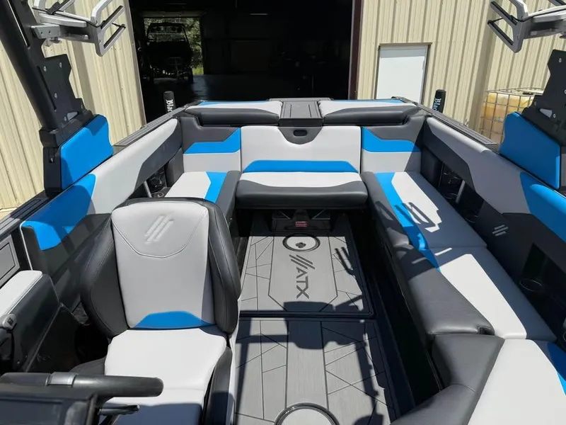 Slide: The Image of 2023 ATX Surf Boats 24 Type-S interior with blue and gray seating, modern design. - 13