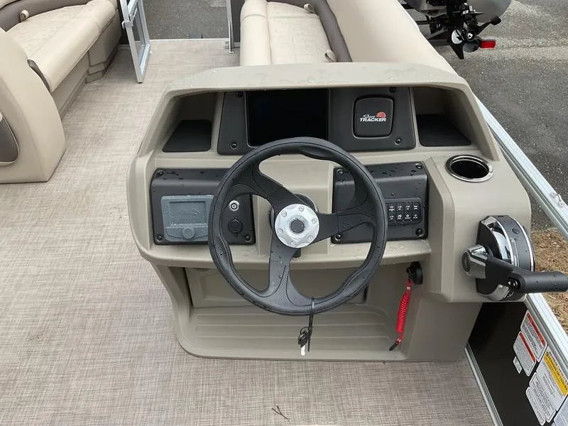 Slide: The Image of 2025 Sun Tracker PARTY BARGE® 18 DLX helm with steering wheel and control panel. - 3