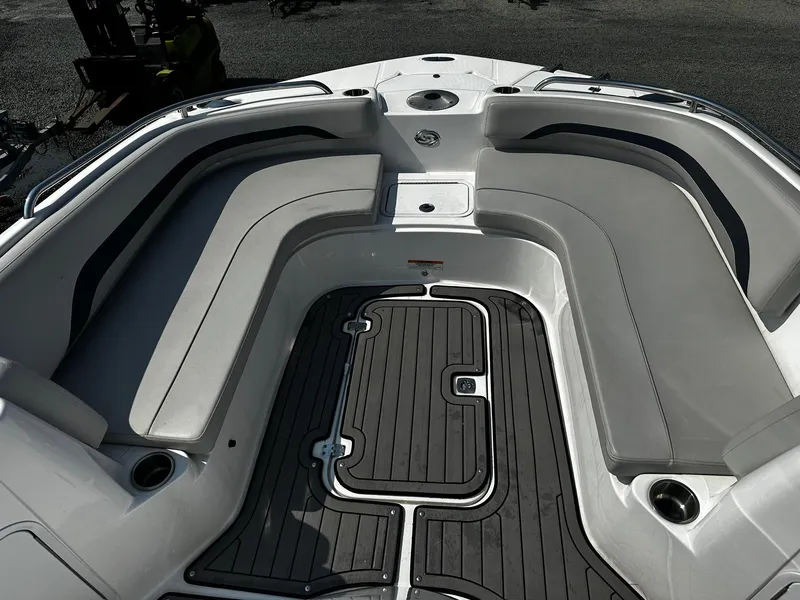Slide: The Image of 2024 Godfrey 231 Center Console boat interior with cushioned seating and sleek flooring. - 11