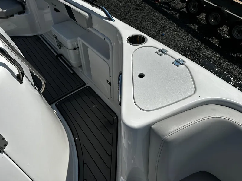Slide: The Image of 2024 Godfrey 231 Center Console boat interior with seating and storage compartments. - 14