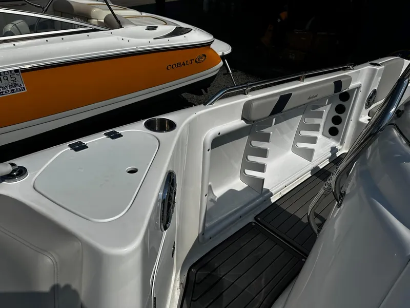 Slide: The Image of 2024 Godfrey 231 Center Console boat interior with seating and storage features. - 15