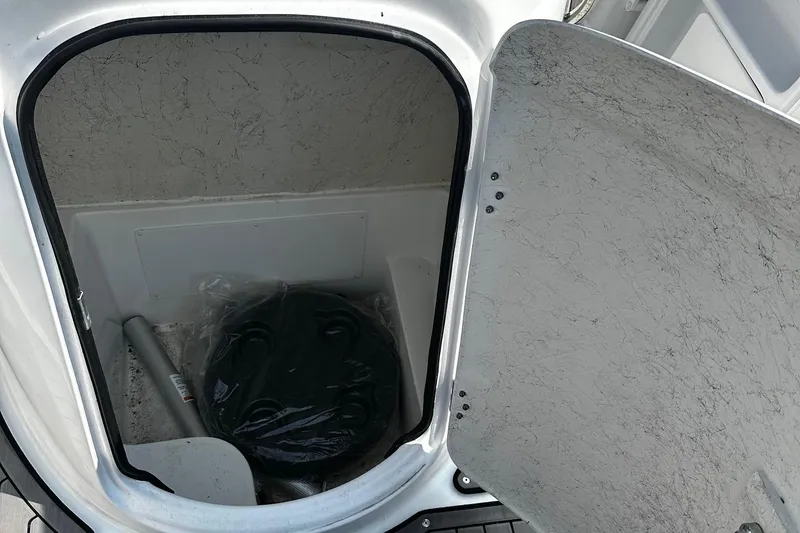 Slide: The Image of Open storage compartment in 2024 Godfrey 231 Center Console boat. - 7