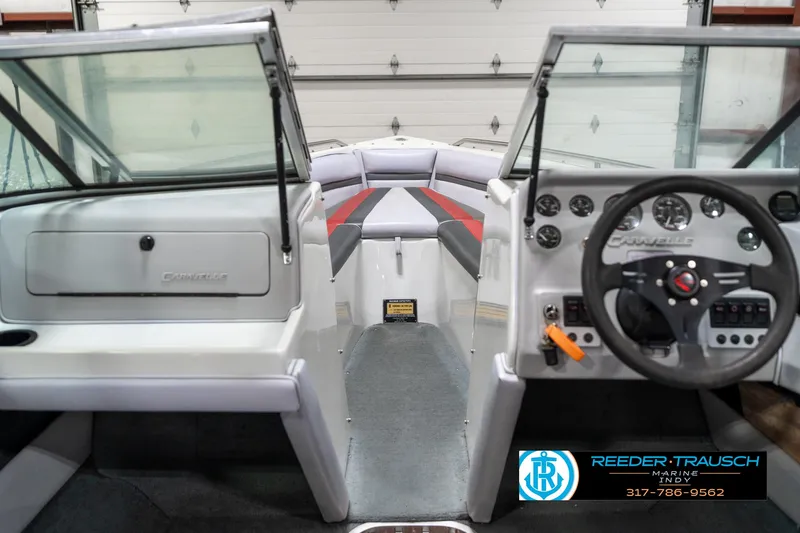 Slide: The Image of Interior of a 1991 Caravelle I2300CC boat with steering wheel and dashboard. - 15