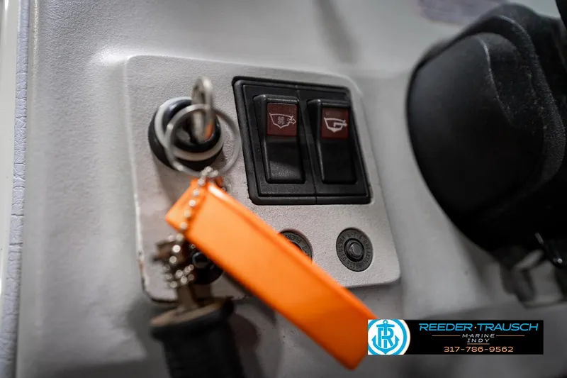 Slide: The Image of Close-up of 1991 Caravelle I2300CC ignition switch with orange keychain and control panel. - 28