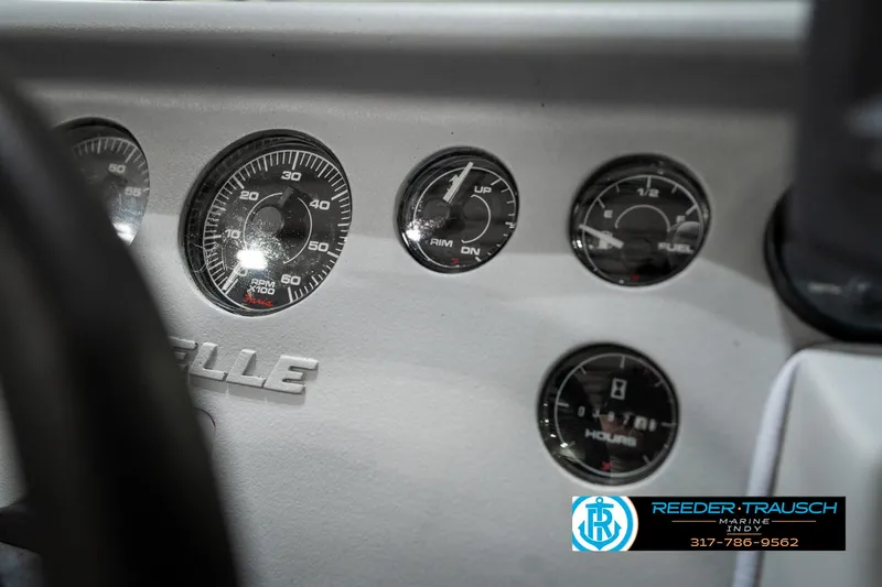 Slide: The Image of Dashboard of a 1991 Caravelle I2300CC boat with gauges and branding. - 30
