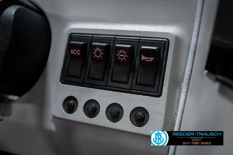 Slide: The Image of Control panel of a 1991 Caravelle I2300CC boat with switches and buttons. - 31