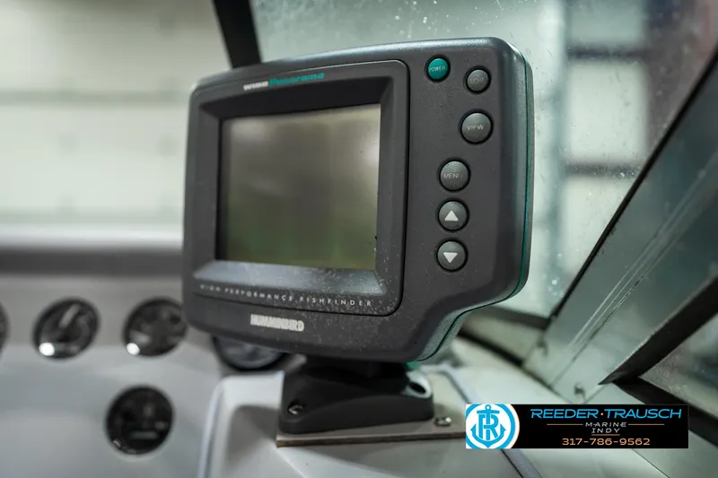 Slide: The Image of Humminbird fishfinder on 1991 Caravelle I2300CC dashboard, Reeder-Trausch Marine logo visible. - 32