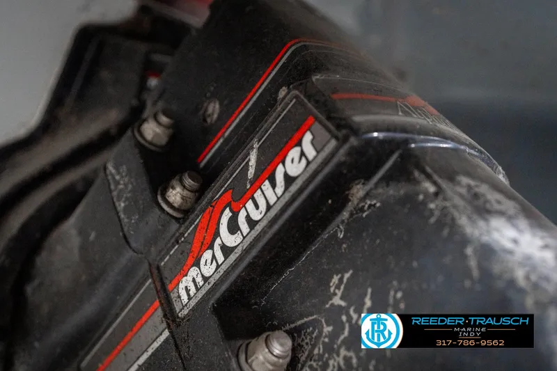 Slide: The Image of MerCruiser engine detail on a 1991 Caravelle I2300CC boat, featuring Reeder-Trausch Marine logo. - 39