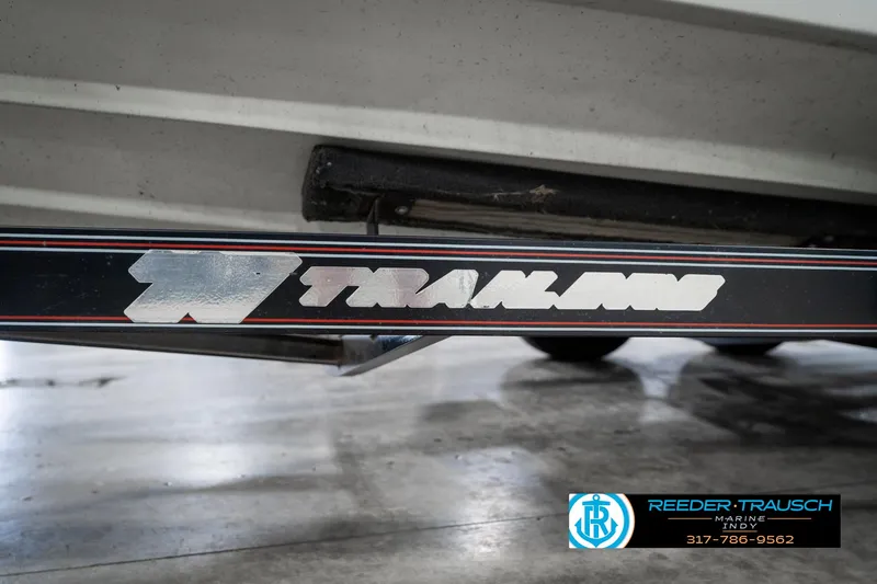 Slide: The Image of Trailer frame with Traxline logo, associated with a 1991 Caravelle I2300CC boat. - 44