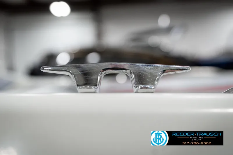 Slide: The Image of Close-up of a 1991 Caravelle I2300CC boat cleat, with Reeder Trausch Marine logo. - 45