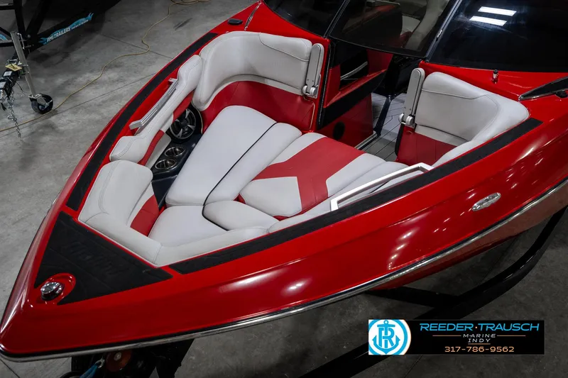 Slide: The Image of 2017 Malibu Wakesetter 25 LSV boat interior with red and white seating. - 11