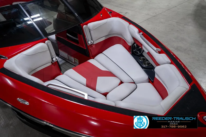 Slide: The Image of 2017 Malibu Wakesetter 25 LSV boat interior with red and white seating. - 12
