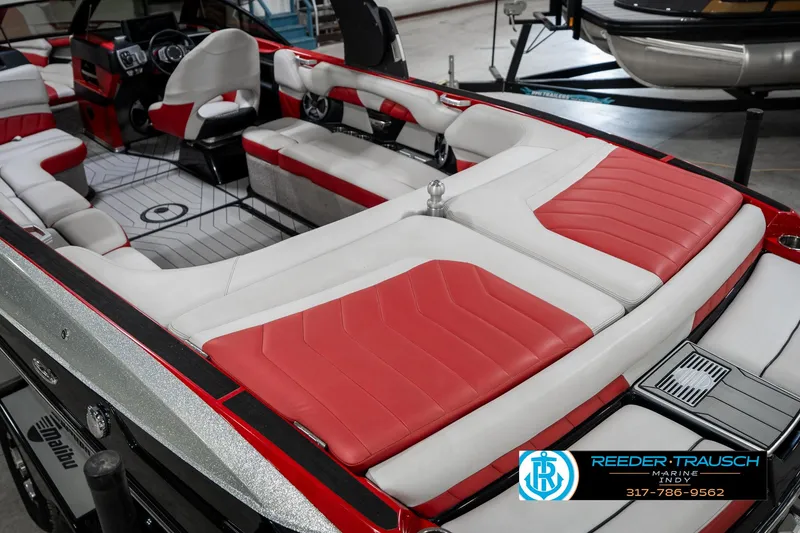 Slide: The Image of 2017 Malibu Wakesetter 25 LSV interior with red and white seating, sleek design. - 14