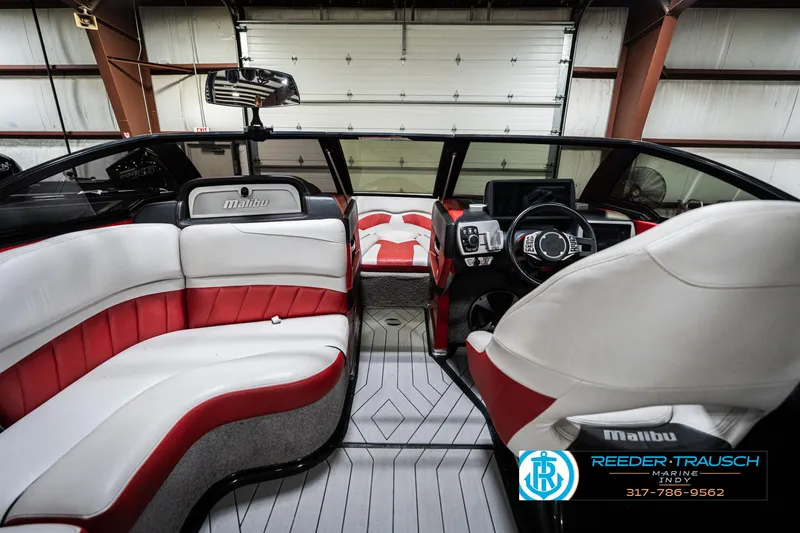 Slide: The Image of Interior of 2017 Malibu Wakesetter 25 LSV boat with red and white seating. - 16