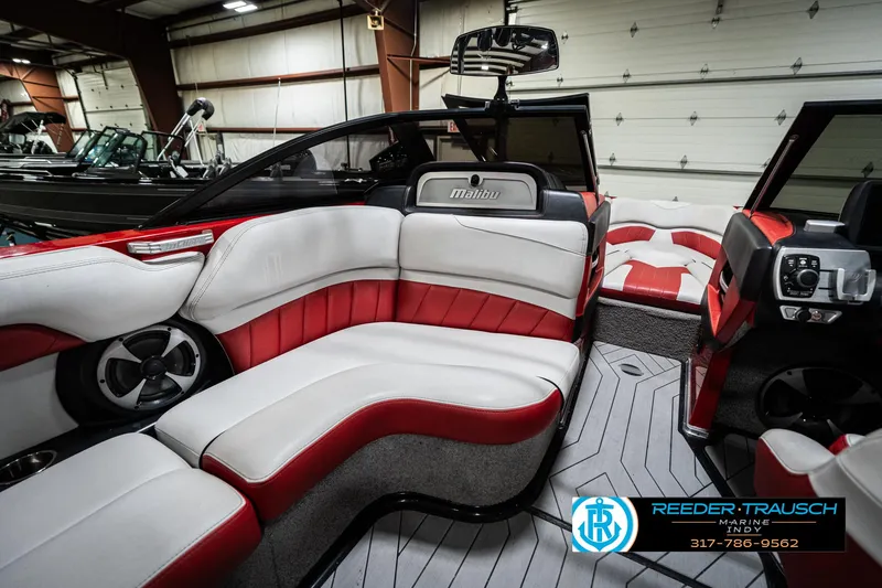 Slide: The Image of 2017 Malibu Wakesetter 25 LSV interior with red and white seating, modern design. - 28