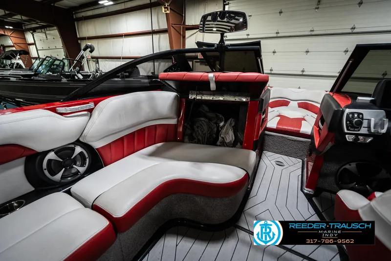 Slide: The Image of 2017 Malibu Wakesetter 25 LSV interior with red and white seating, modern design. - 30
